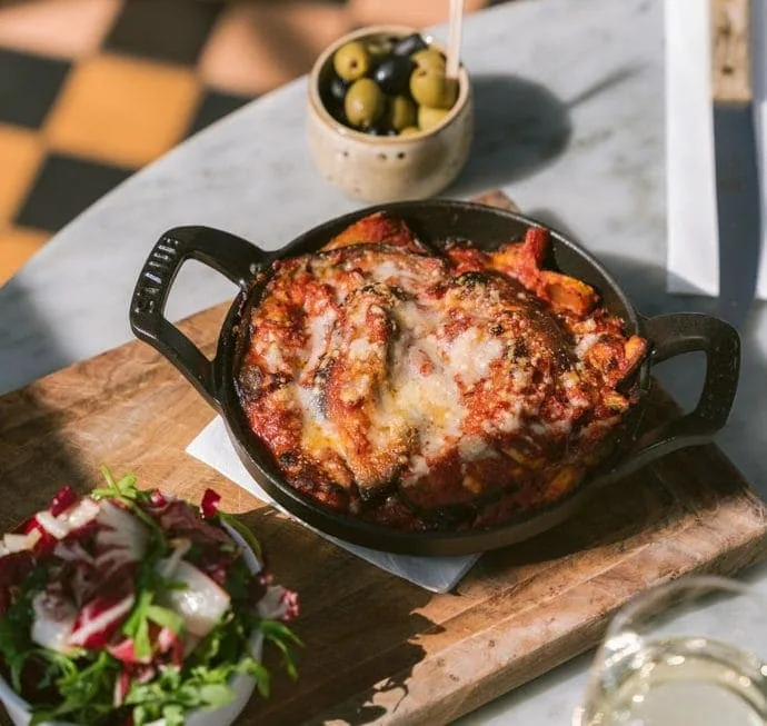 0053-2022-Gees-Restaurant-Bar-Oxford-High-Res-Conservatory-Food-Aubergine-Parmigiana-Mixed-Leaf-Salad-Web-Feature-aspect-ratio-690-653